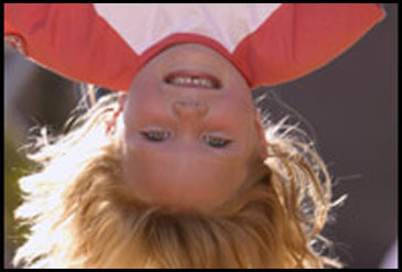 Girl hanging upside down