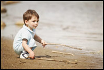 Boy playing with sticks