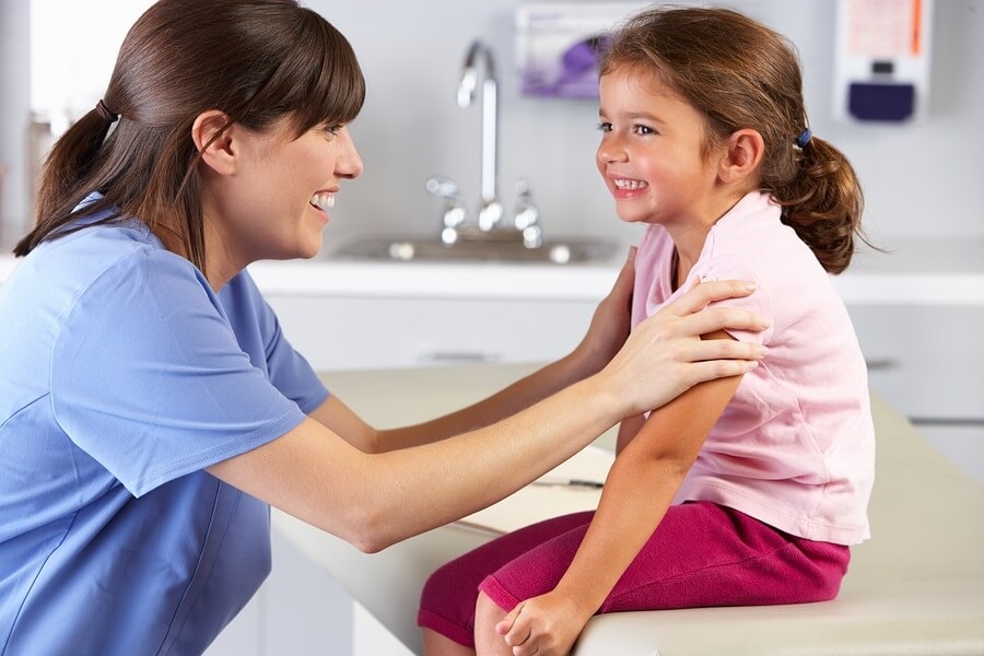 Happy child visiting doctor