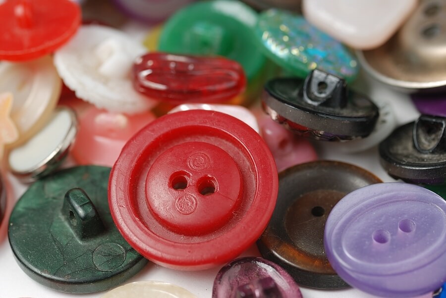 Closeup of a pile of colorful buttons.