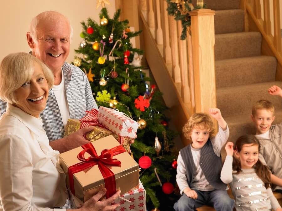 Grandparents arriving with Christmas presents for grandkids