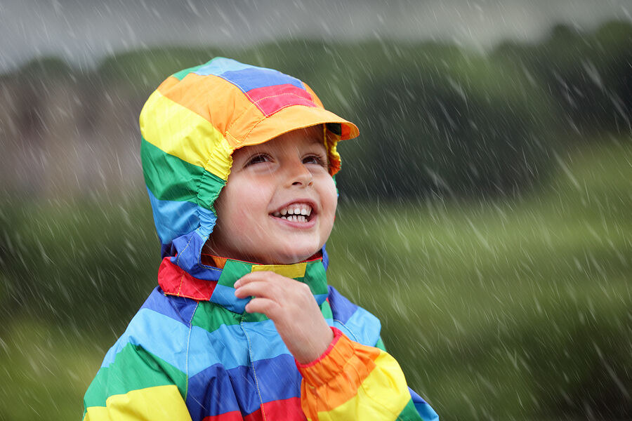 preschool child playing in rain